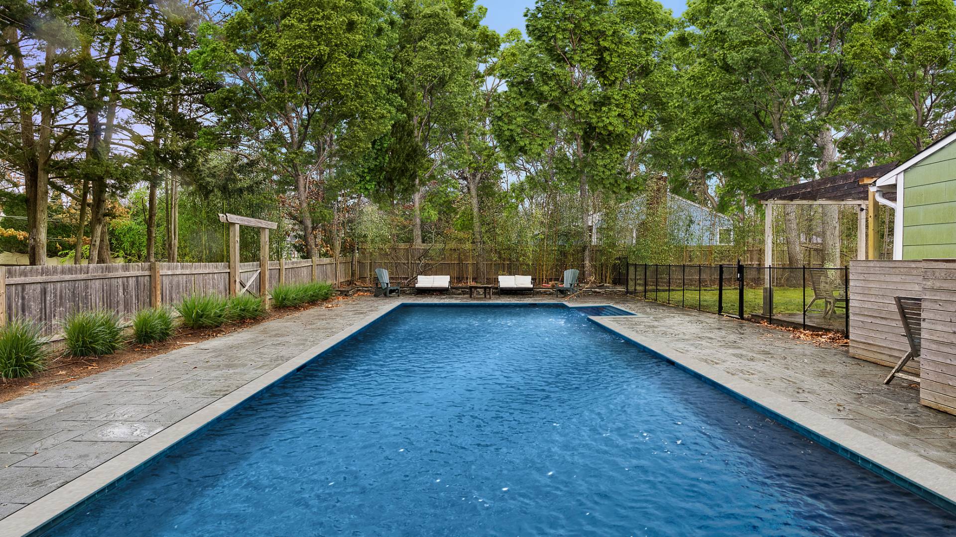 28 Pine Tree Road Southampton, NY 11968 - Photo 2 of 14 a view of a backyard with a garden