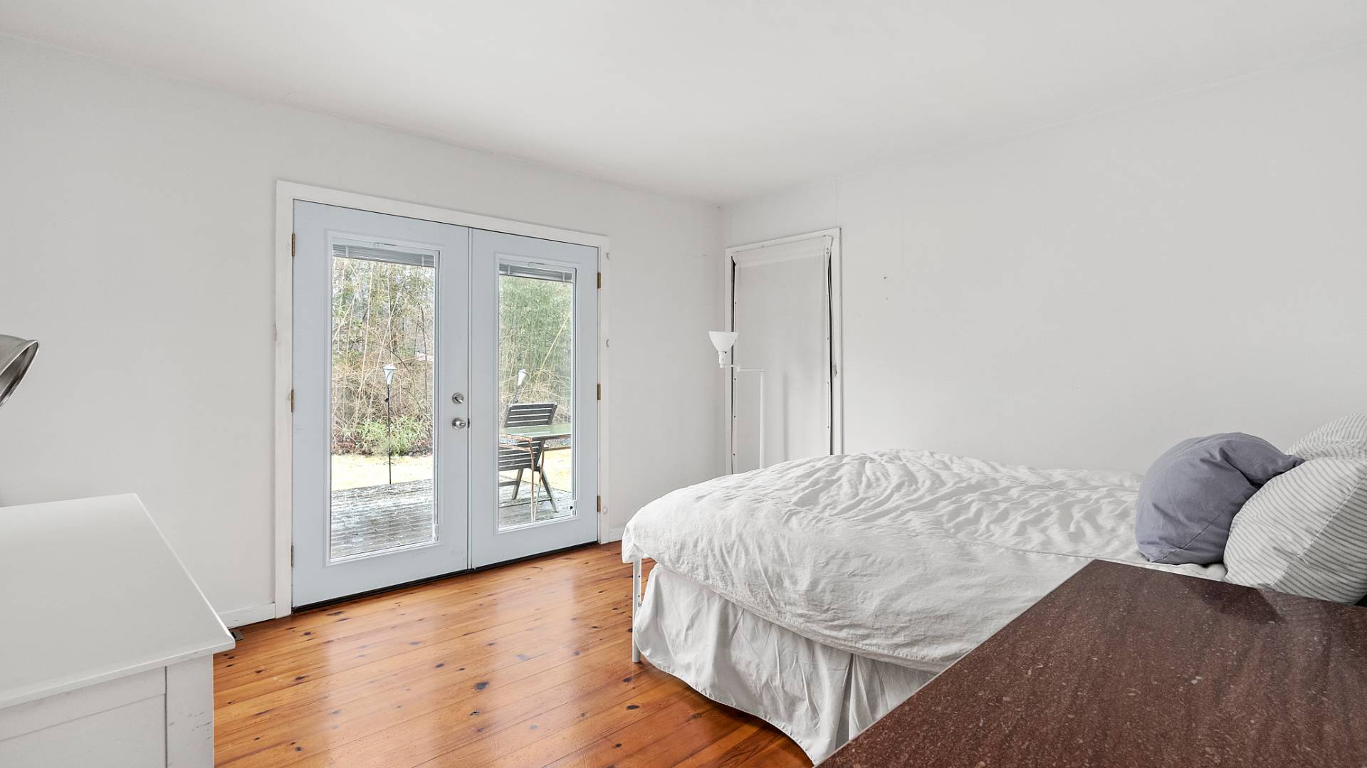 28 Pine Tree Road Southampton, NY 11968 - Photo 9 of 14 a bedroom with a bed and window