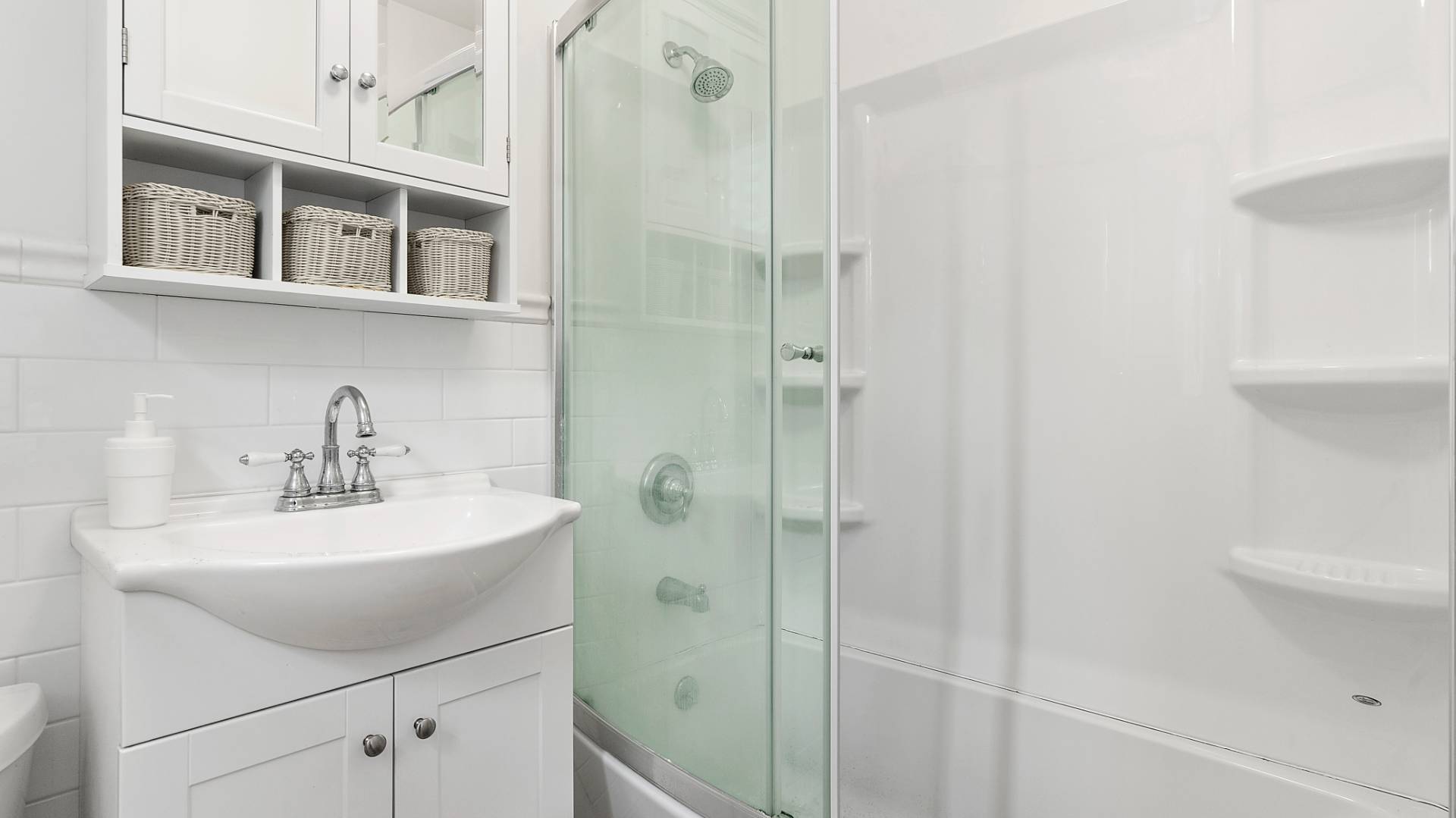 28 Pine Tree Road Southampton, NY 11968 - Photo 10 of 14 a bathroom with a sink a toilet and shower