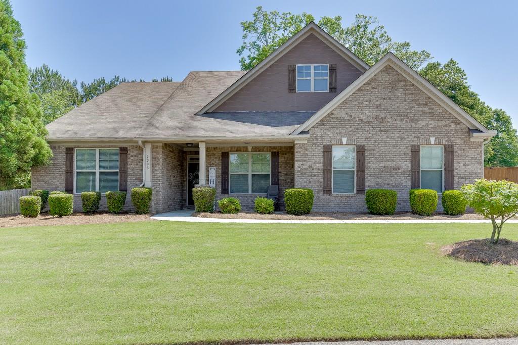 2906 Jones Phillips Road Dacula, GA 30019 - Photo 1 of 53 a front view of a house with a yard and garage