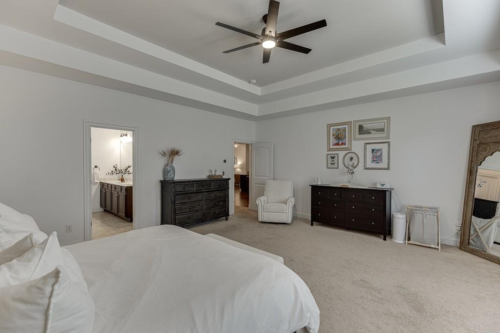 2906 Jones Phillips Road Dacula, GA 30019 - Photo 25 of 53 a bedroom with a bed and a dresser