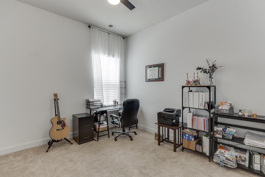 2906 Jones Phillips Road Dacula, GA 30019 - Photo 29 of 53 a view of a workspace with furniture and a window