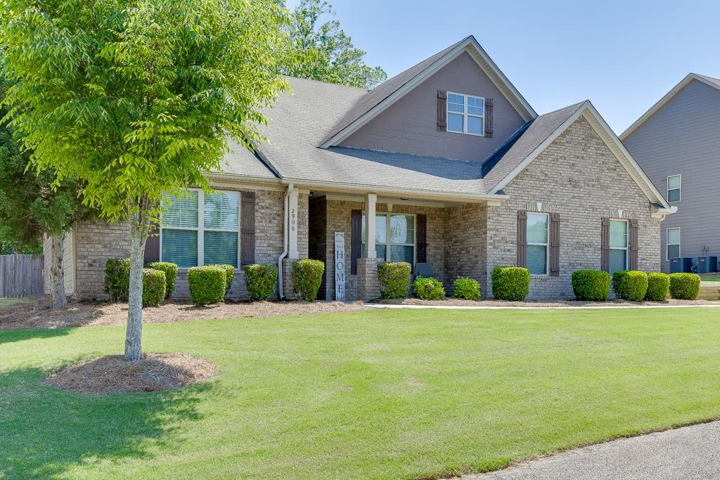 2906 Jones Phillips Road Dacula, GA 30019 - Photo 3 of 53 a front view of a house with a yard and garage