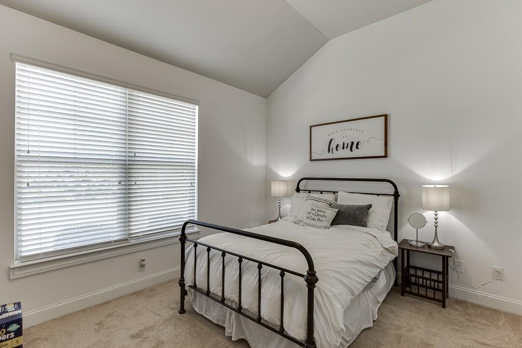 2906 Jones Phillips Road Dacula, GA 30019 - Photo 32 of 53 a bedroom with a large bed and a window