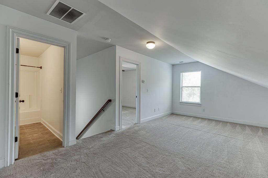 2906 Jones Phillips Road Dacula, GA 30019 - Photo 37 of 53 an empty room with windows and closet