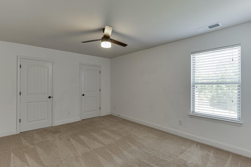 2906 Jones Phillips Road Dacula, GA 30019 - Photo 39 of 53 a view of an empty room with a window