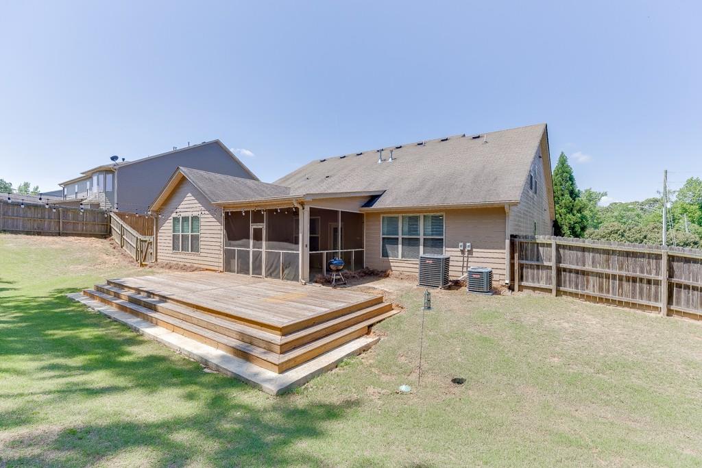 2906 Jones Phillips Road Dacula, GA 30019 - Photo 44 of 53 a view of house with yard and sitting area