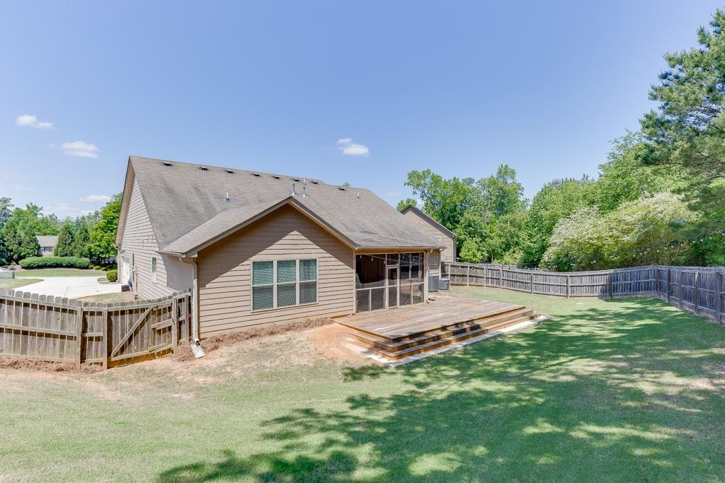 2906 Jones Phillips Road Dacula, GA 30019 - Photo 46 of 53 a house view with a garden space