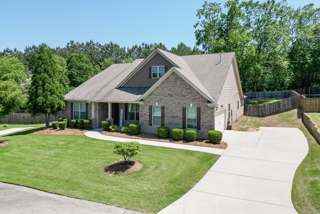 2906 Jones Phillips Road Dacula, GA 30019 - Photo 48 of 53 a front view of a house with a yard