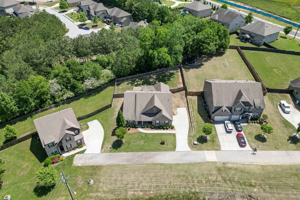 2906 Jones Phillips Road Dacula, GA 30019 - Photo 50 of 53 an aerial view of residential houses with outdoor space