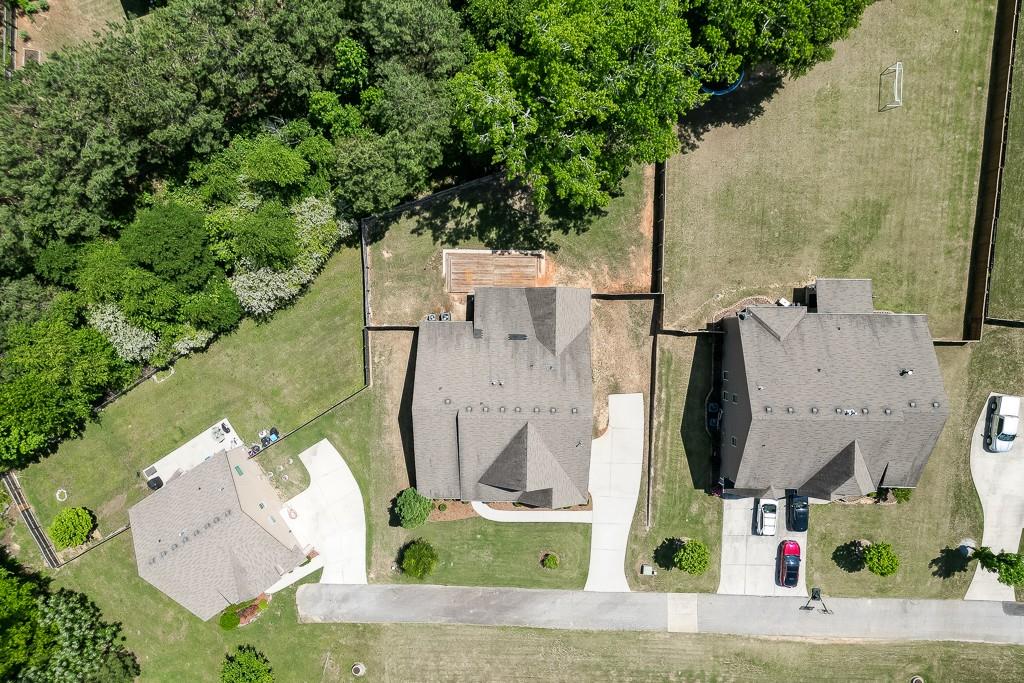 2906 Jones Phillips Road Dacula, GA 30019 - Photo 51 of 53 an aerial view of multiple house with outdoor space