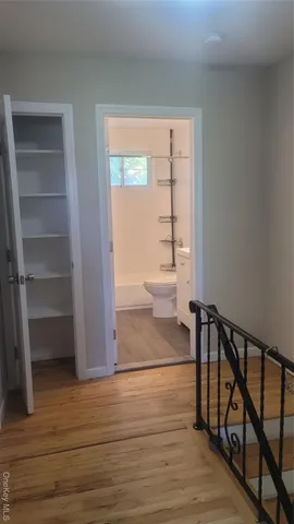 a view of entryway with wooden floor