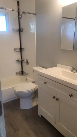 a bathroom with a sink a toilet and bathtub