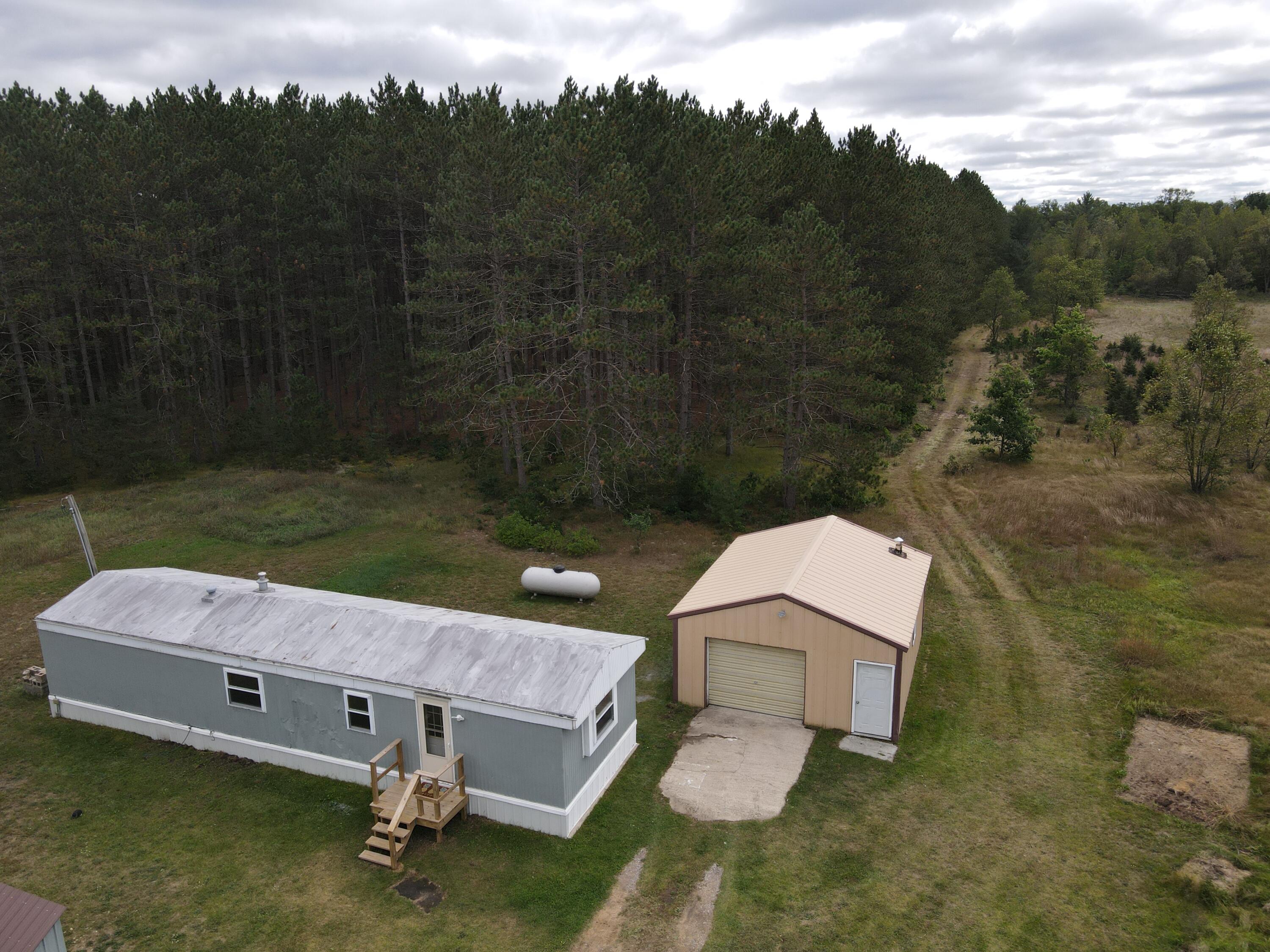 9541 Pine Road Marion, MI 49665 - Photo 2 of 30 Photo_1080296111_DJI_687_jpg_5781499_0_2