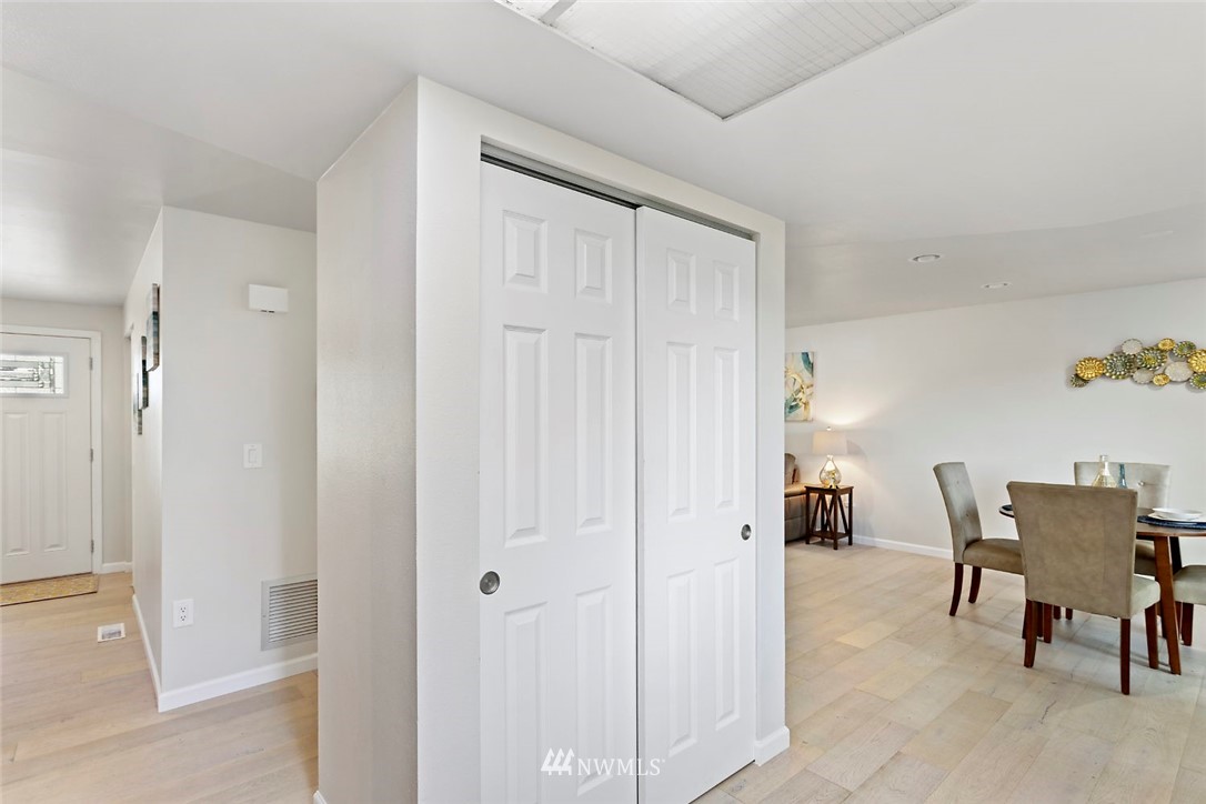 6609 Southeast 4th Place Renton, WA 98059 - Photo 12 of 26 a view of a hallway with chairs and a dining table in a room