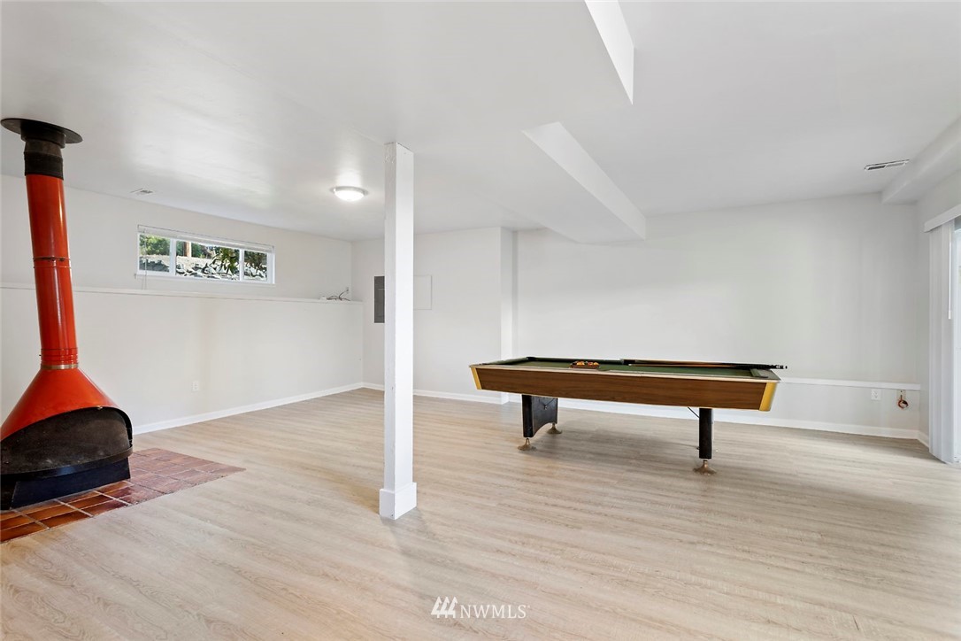 6609 Southeast 4th Place Renton, WA 98059 - Photo 17 of 26 a view of a room with wooden floor and furniture