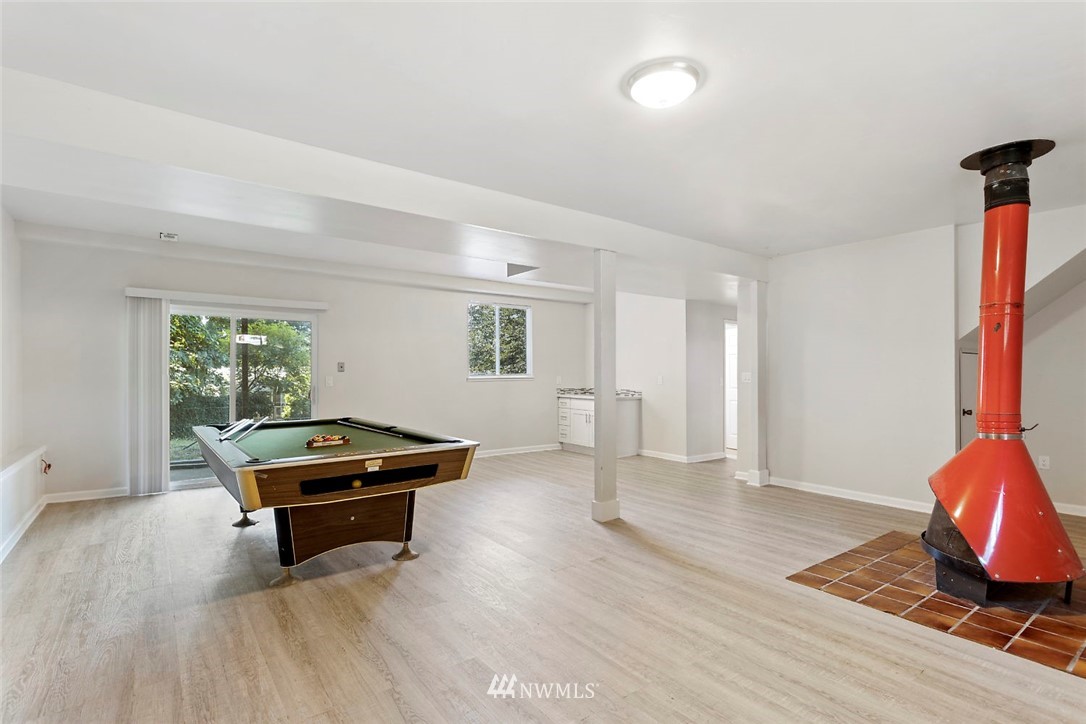 6609 Southeast 4th Place Renton, WA 98059 - Photo 18 of 26 a living room with furniture and a wooden floor