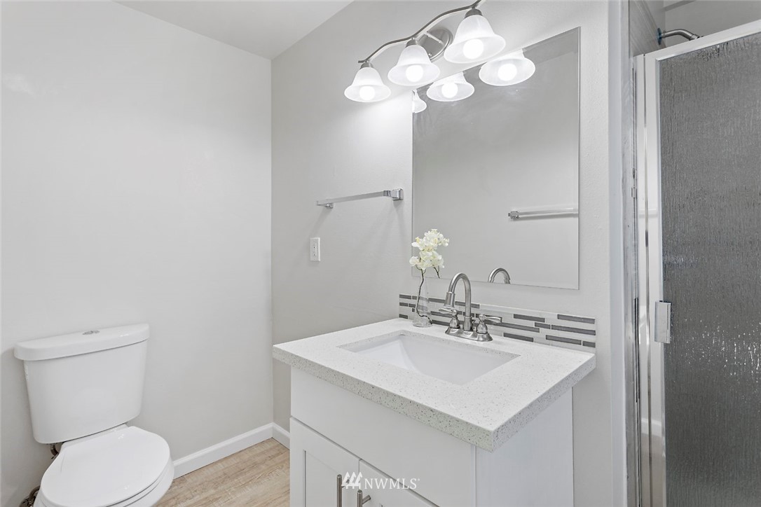 6609 Southeast 4th Place Renton, WA 98059 - Photo 22 of 26 a bathroom with a sink and a toilet