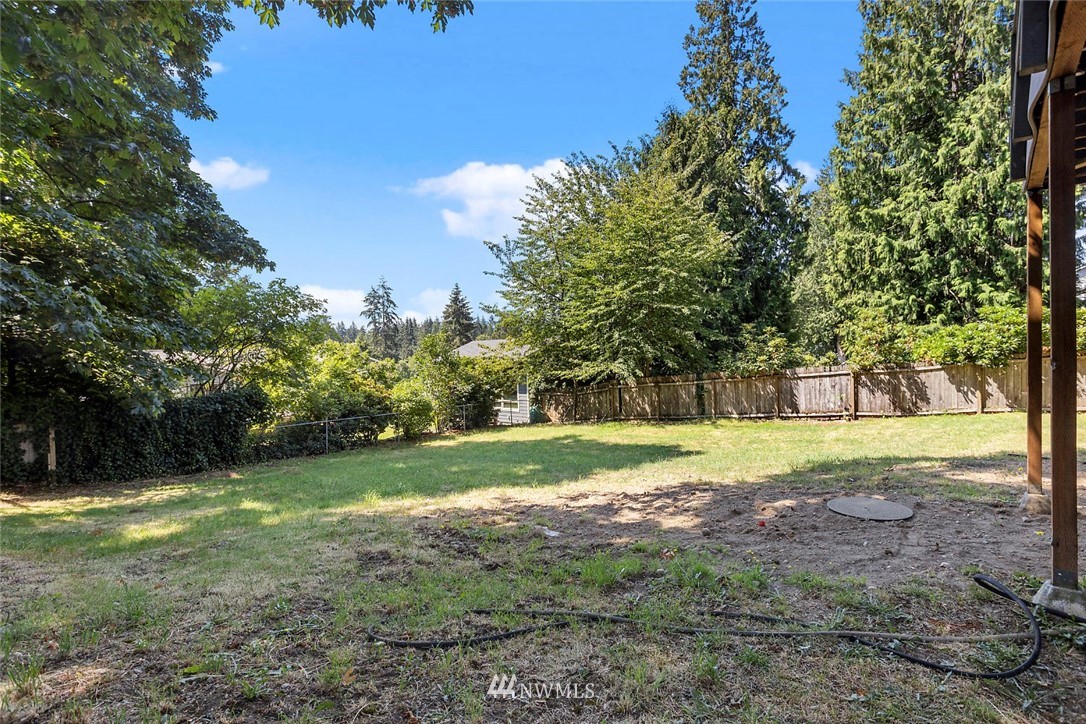 6609 Southeast 4th Place Renton, WA 98059 - Photo 25 of 26 a view of a yard with a house in the background