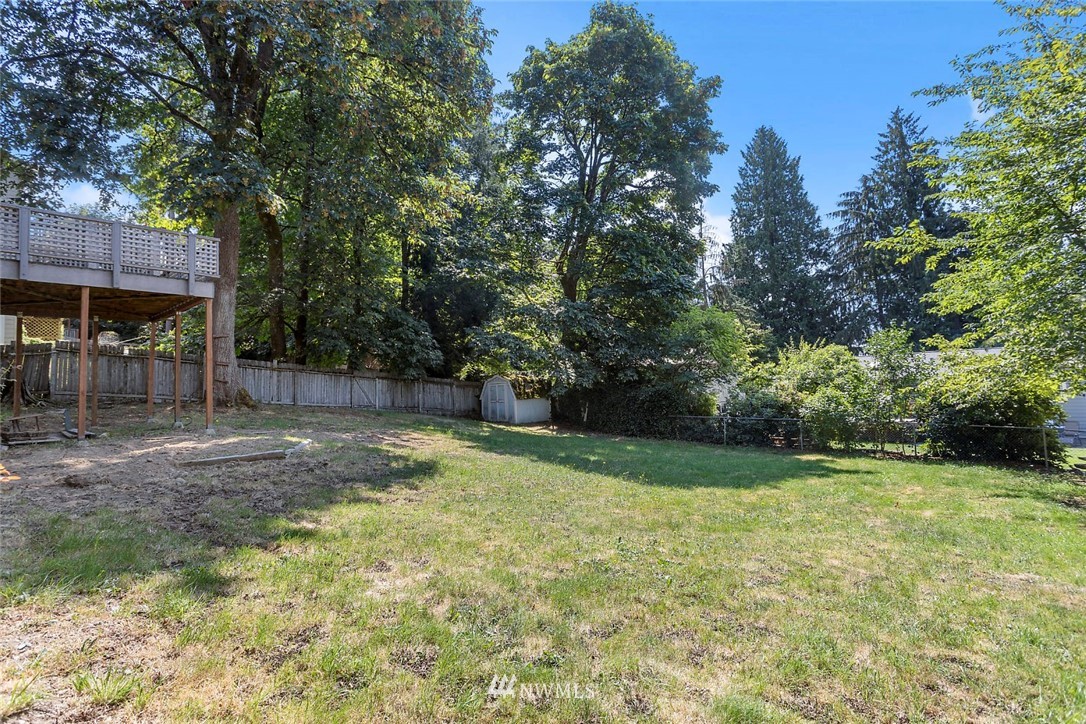 6609 Southeast 4th Place Renton, WA 98059 - Photo 26 of 26 a view of a backyard with large trees