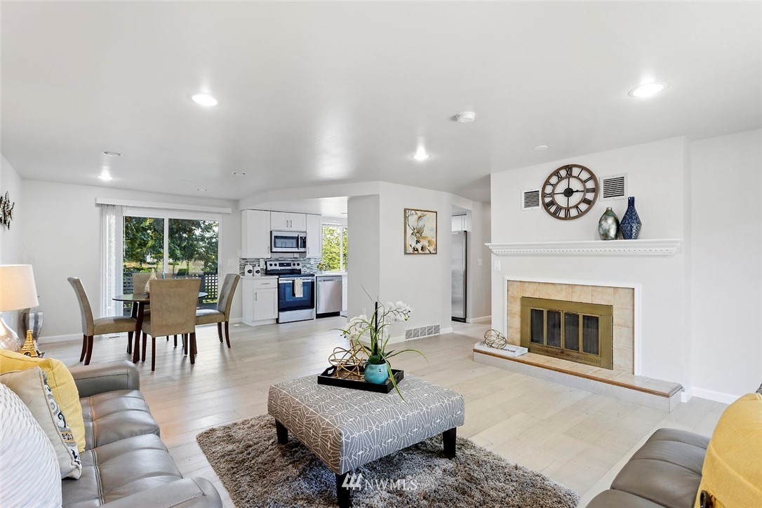 6609 Southeast 4th Place Renton, WA 98059 - Photo 7 of 26 a living room with furniture and a fireplace