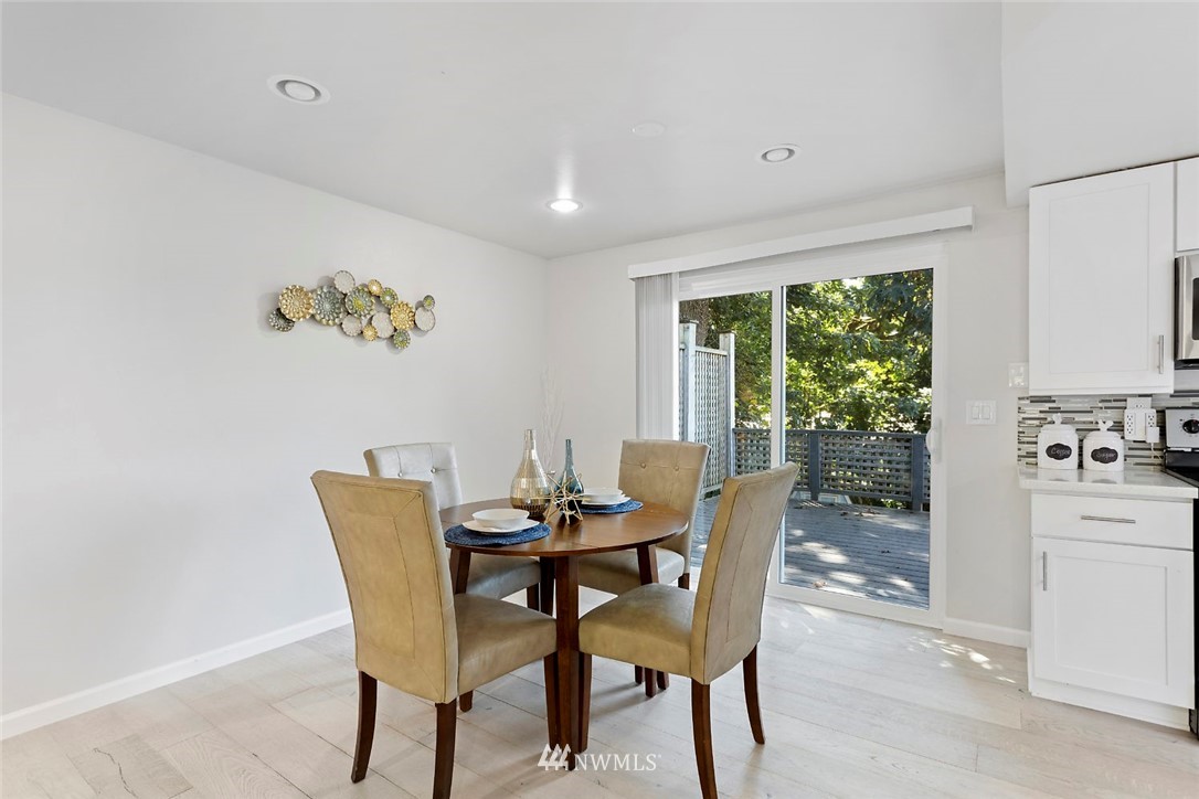 6609 Southeast 4th Place Renton, WA 98059 - Photo 8 of 26 a view of a dining room with furniture and a potted plant