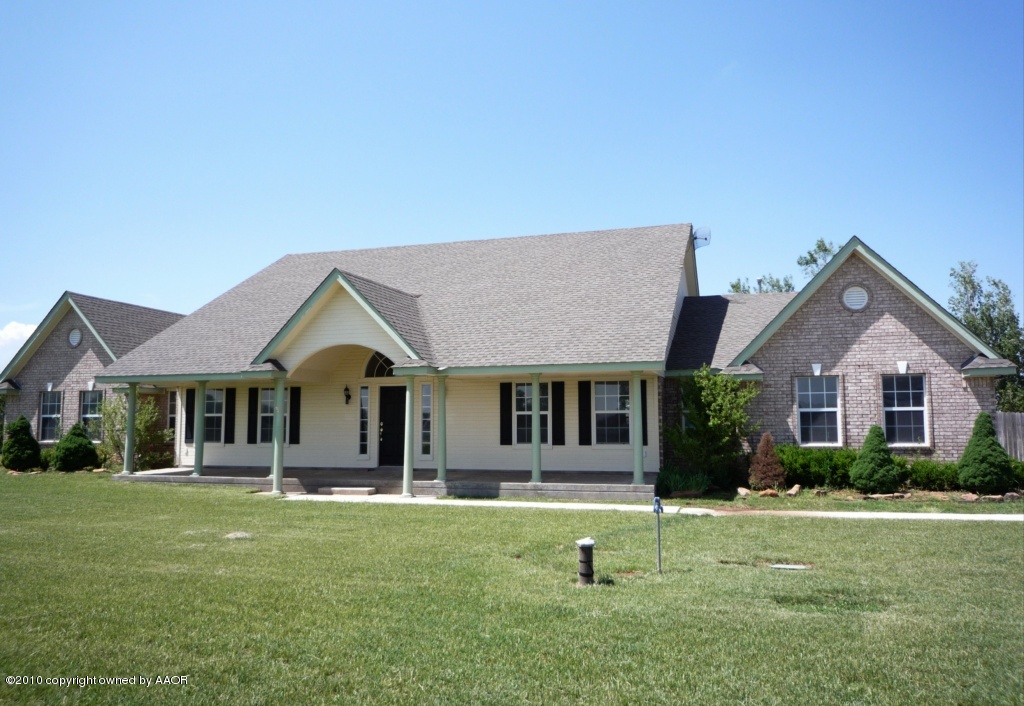 8950 Red Wing Road Amarillo, TX 79119 - Photo 1 of 29 a front view of a house with a yard
