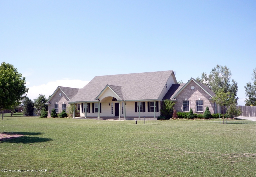 8950 Red Wing Road Amarillo, TX 79119 - Photo 2 of 29 a front view of house with yard and green space