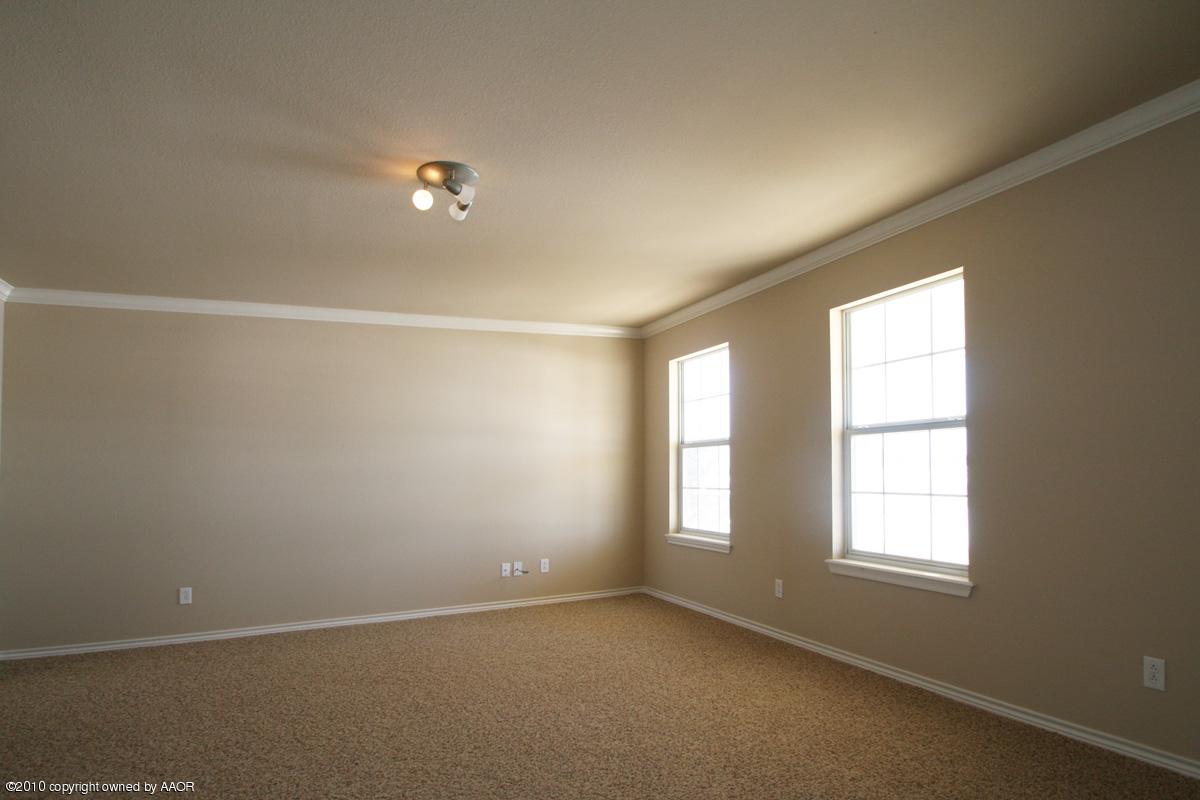 8950 Red Wing Road Amarillo, TX 79119 - Photo 11 of 29 an empty room with windows