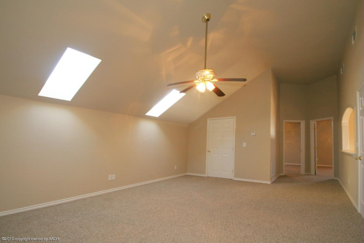 8950 Red Wing Road Amarillo, TX 79119 - Photo 12 of 29 a view of a chandelier fan and fire place