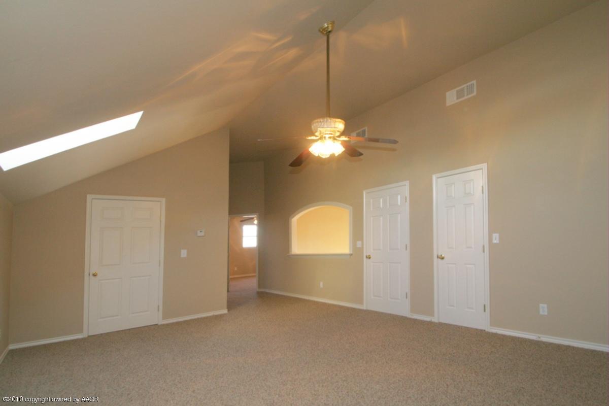 8950 Red Wing Road Amarillo, TX 79119 - Photo 13 of 29 a view of a chandelier in big room and chandelier fan