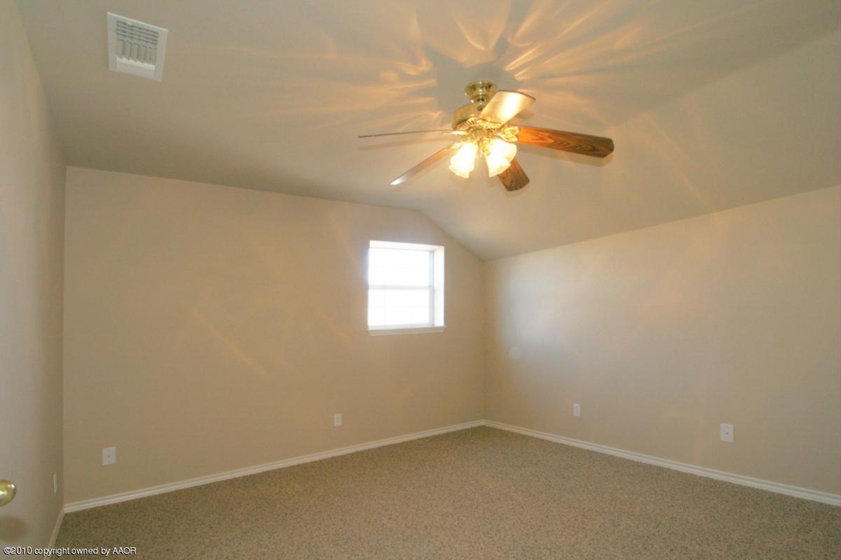 8950 Red Wing Road Amarillo, TX 79119 - Photo 14 of 29 an empty room with a window and a fan