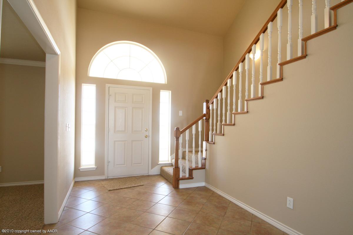 8950 Red Wing Road Amarillo, TX 79119 - Photo 4 of 29 a view of entryway and hall with wooden floor