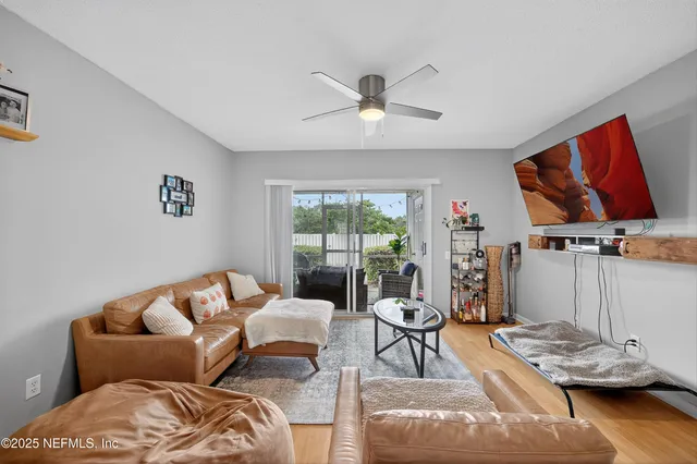 a living room with furniture and a window