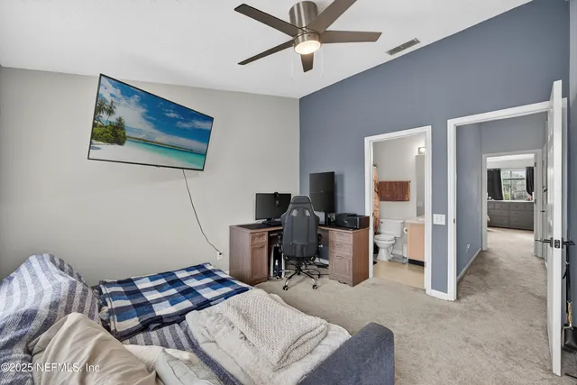 a bedroom with furniture and a window