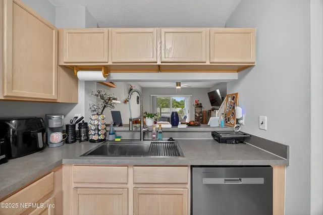 a kitchen with a sink and cabinets