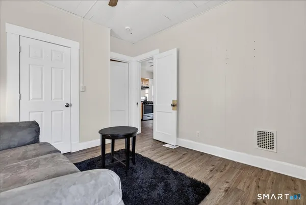 a living room with furniture and a rug