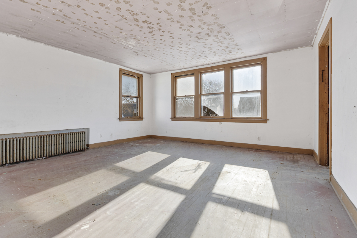 118 East 105th Street Chicago, IL 60628 - Photo 12 of 26 a view of an empty room with a window