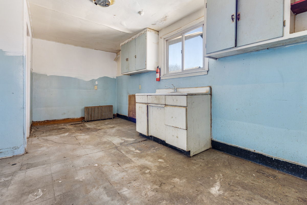 118 East 105th Street Chicago, IL 60628 - Photo 14 of 26 a utility room with cabinets