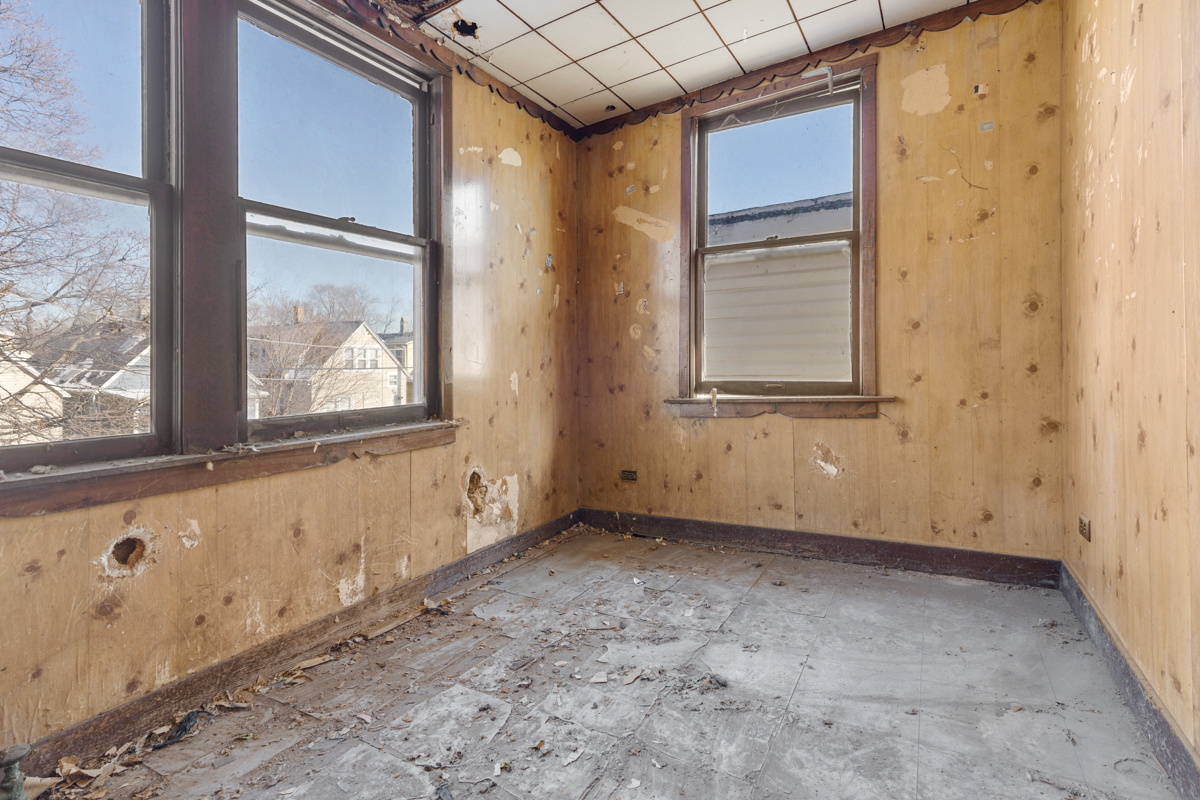 118 East 105th Street Chicago, IL 60628 - Photo 16 of 26 a view of an empty room with a window