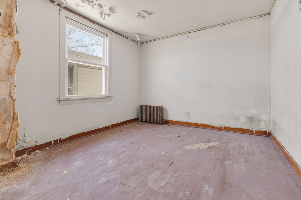 118 East 105th Street Chicago, IL 60628 - Photo 19 of 26 a view of an empty room with a window