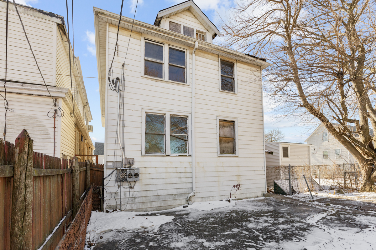 118 East 105th Street Chicago, IL 60628 - Photo 24 of 26 a view of a house with a yard