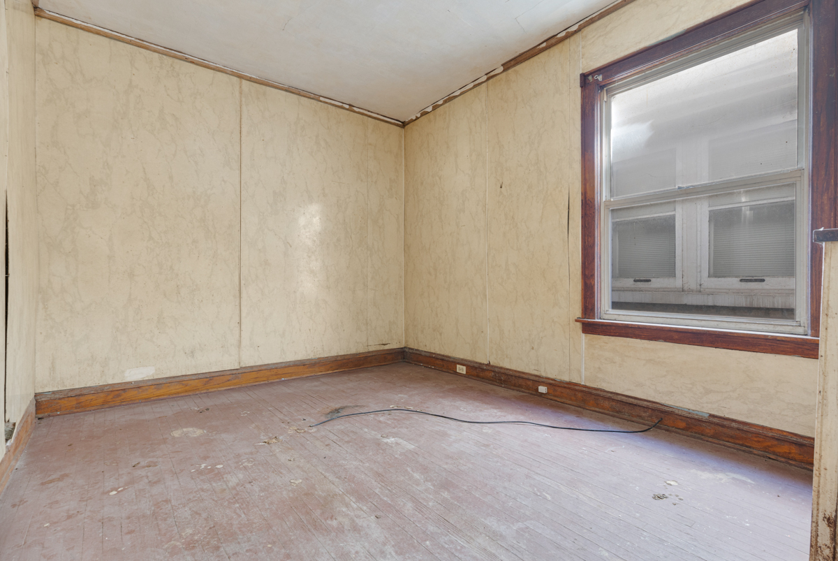 118 East 105th Street Chicago, IL 60628 - Photo 10 of 26 a view of an empty room with a window