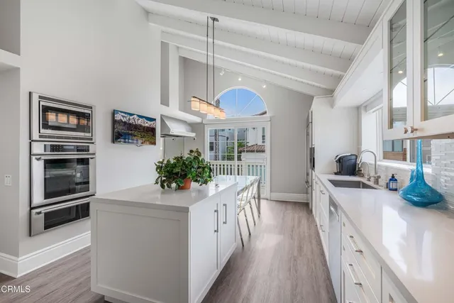a kitchen with a sink and a microwave