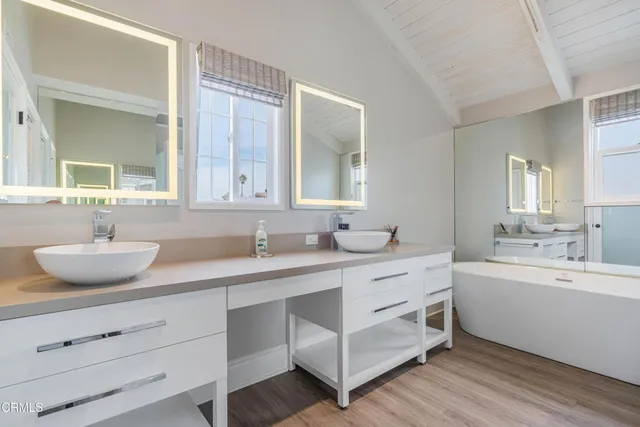 a white bath tub sitting in a bathroom