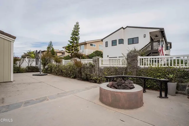 a front view of a house with sitting area