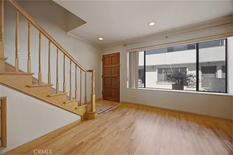 a view of an entryway with wooden floor