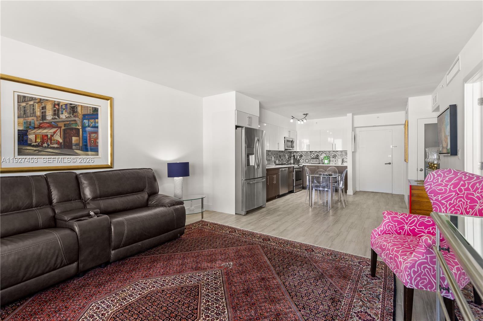 100 Lincoln Road, Unit 643 Miami Beach, FL 33139 - Photo 13 of 17 a living room with furniture and kitchen view