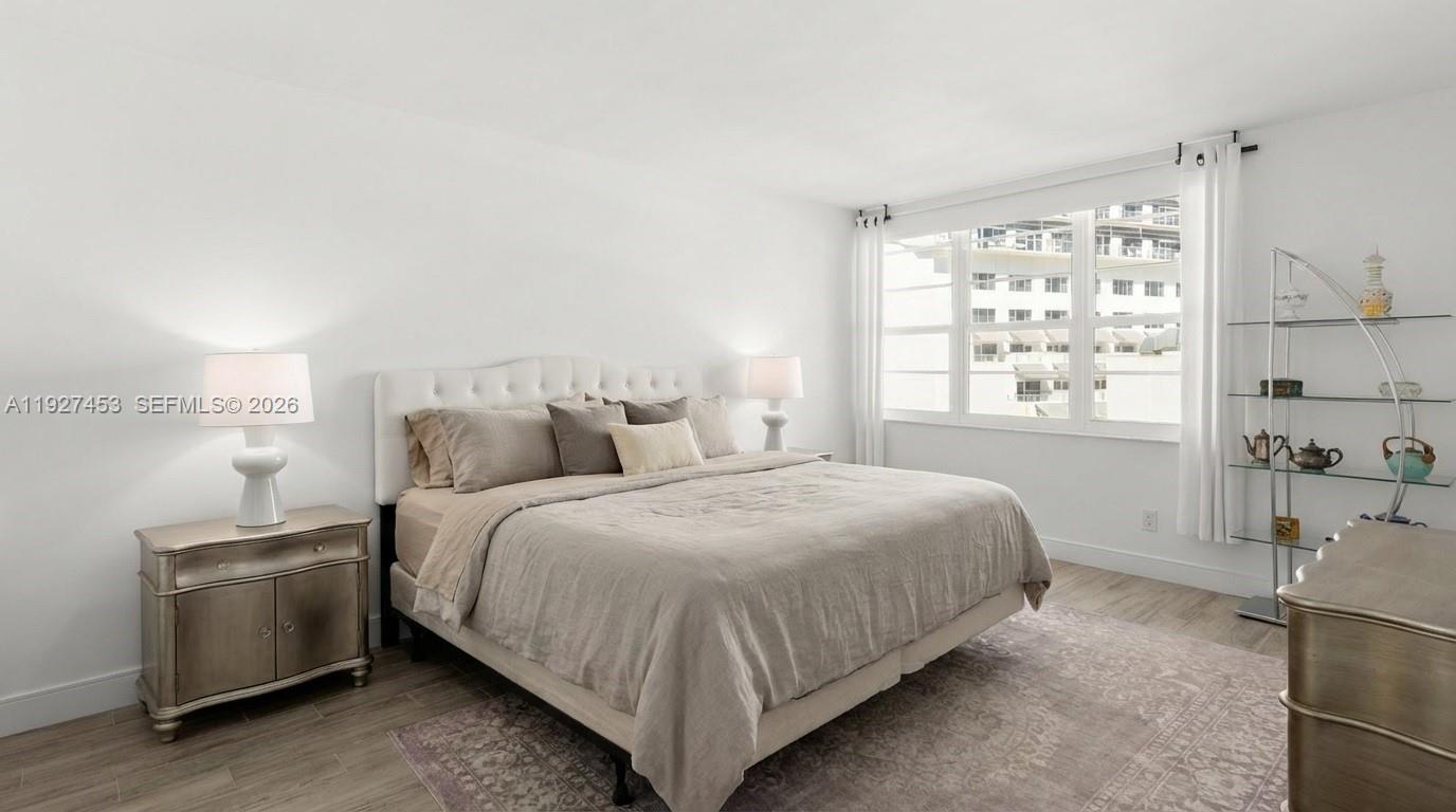 100 Lincoln Road, Unit 643 Miami Beach, FL 33139 - Photo 16 of 17 a bedroom with a bed and a window