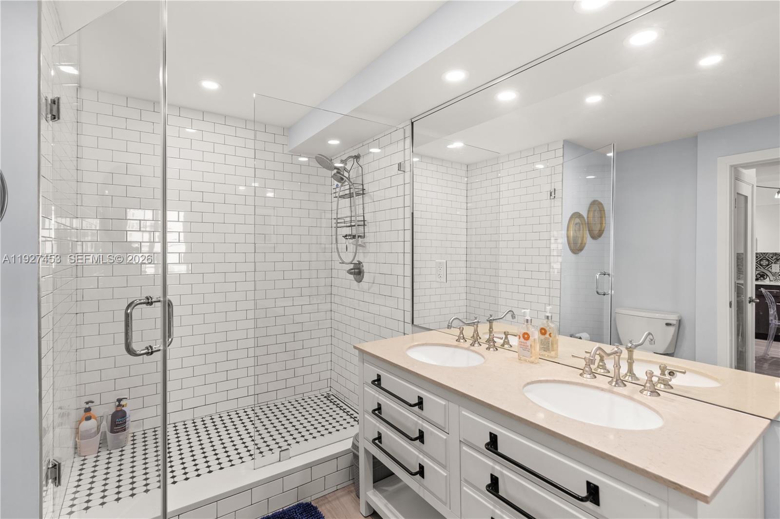 100 Lincoln Road, Unit 643 Miami Beach, FL 33139 - Photo 2 of 17 a bathroom with a double vanity sink mirror and double